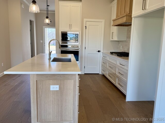 unfurnished dining area with an inviting chandelier, wood-type flooring, and ornamental molding