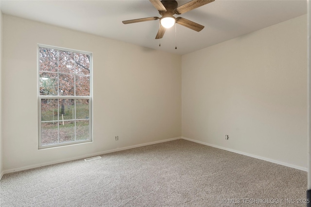 carpeted empty room with ceiling fan