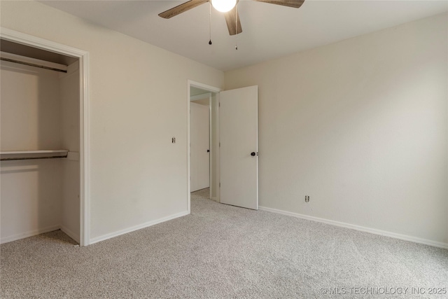 unfurnished bedroom featuring a closet, ceiling fan, and light colored carpet