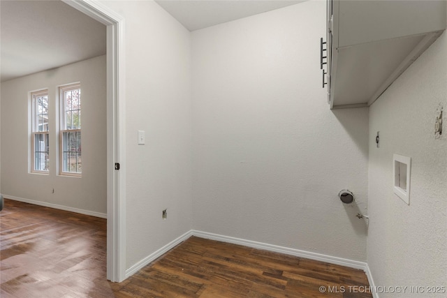 washroom featuring dark wood-type flooring and gas dryer hookup