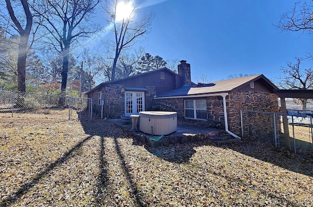 rear view of property with french doors