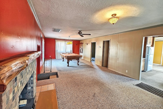 rec room featuring carpet flooring, ornamental molding, a textured ceiling, and pool table