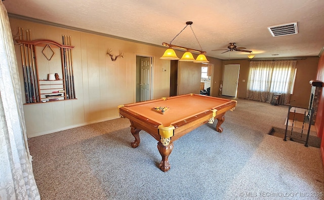 game room featuring a textured ceiling, carpet floors, billiards, ornamental molding, and ceiling fan