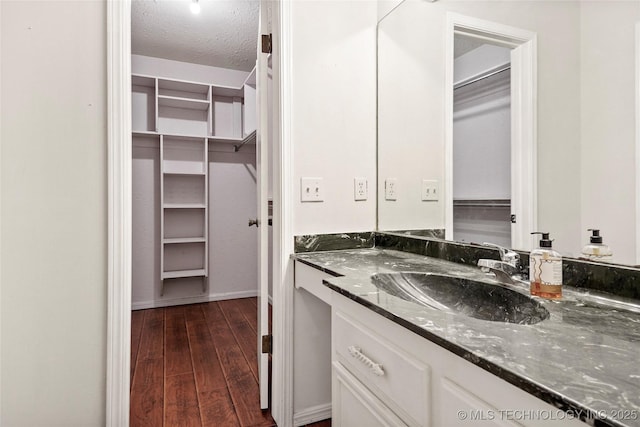 bathroom with vanity and a textured ceiling