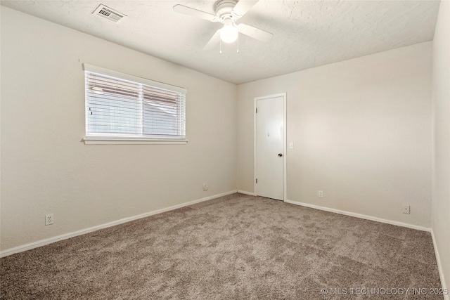 unfurnished room with carpet flooring and ceiling fan