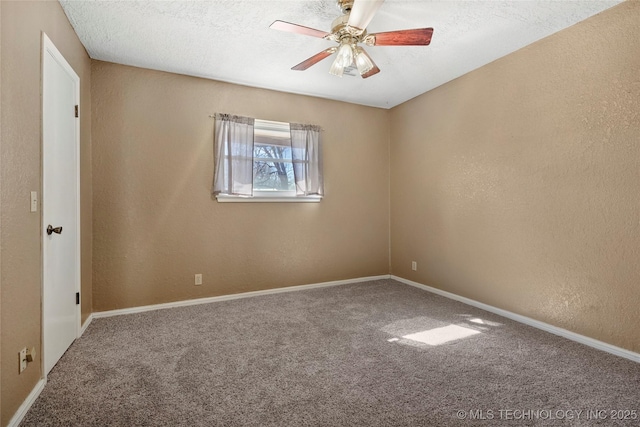 unfurnished room with a textured ceiling, ceiling fan, and carpet