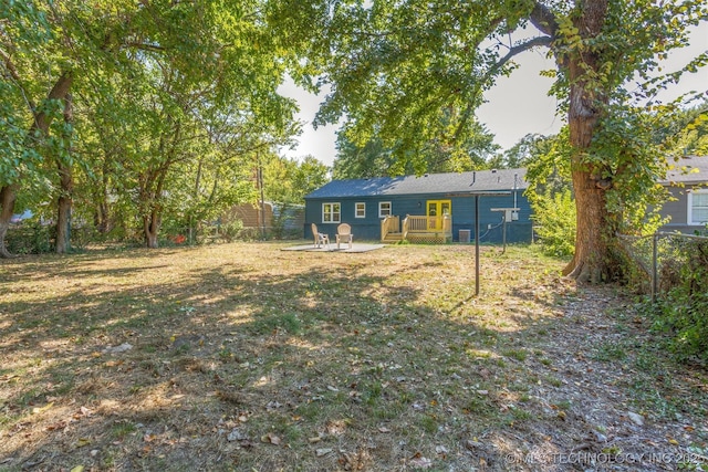 view of yard featuring a wooden deck