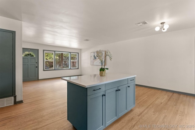 kitchen featuring a center island and light hardwood / wood-style flooring