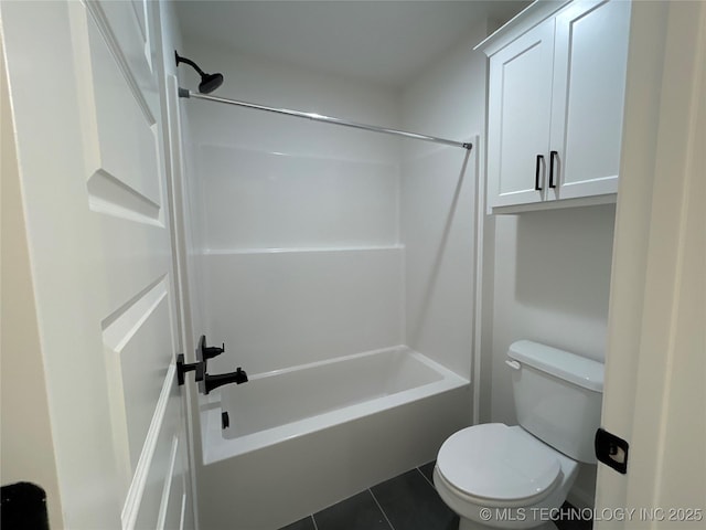 bathroom with toilet, tile patterned floors, and shower / bathing tub combination