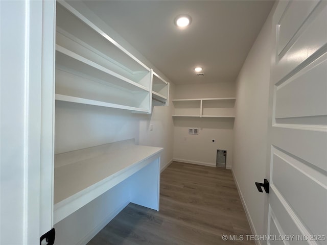 clothes washing area featuring washer hookup, dark wood-style flooring, laundry area, recessed lighting, and hookup for an electric dryer