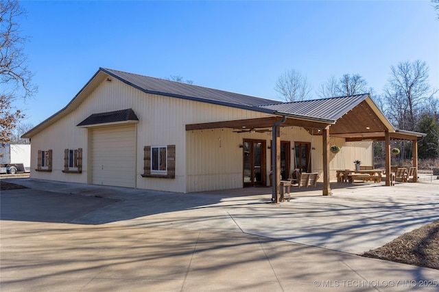 exterior space with ceiling fan and a patio