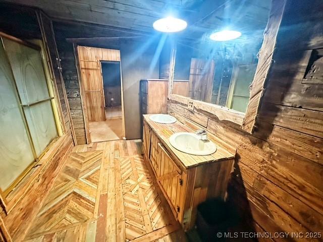 bathroom featuring vanity and parquet floors