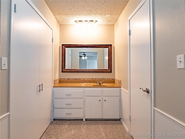 bathroom with vanity and a textured ceiling