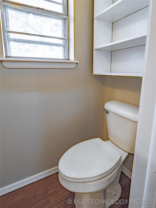 bathroom featuring toilet and hardwood / wood-style flooring