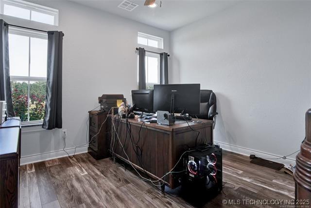 office space featuring ceiling fan, a wealth of natural light, and hardwood / wood-style floors