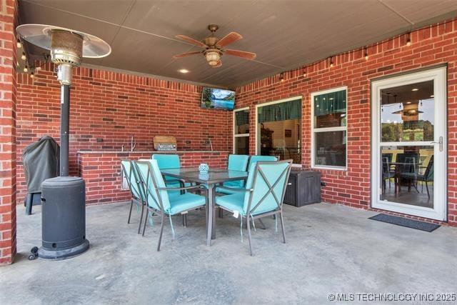 view of patio / terrace featuring ceiling fan and area for grilling