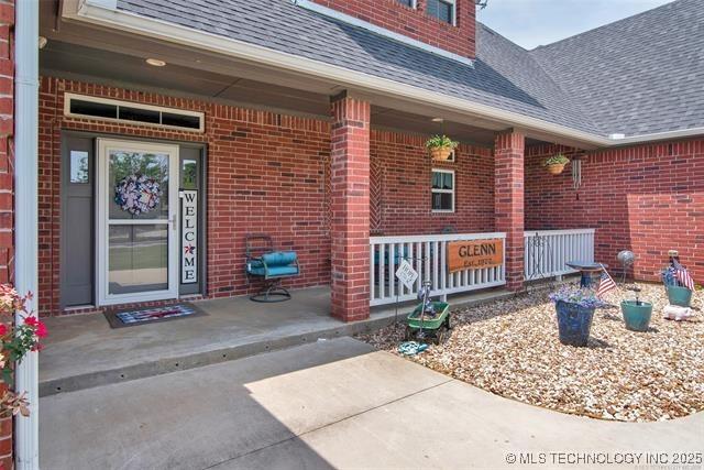 doorway to property with a porch