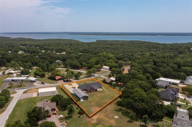 birds eye view of property featuring a water view