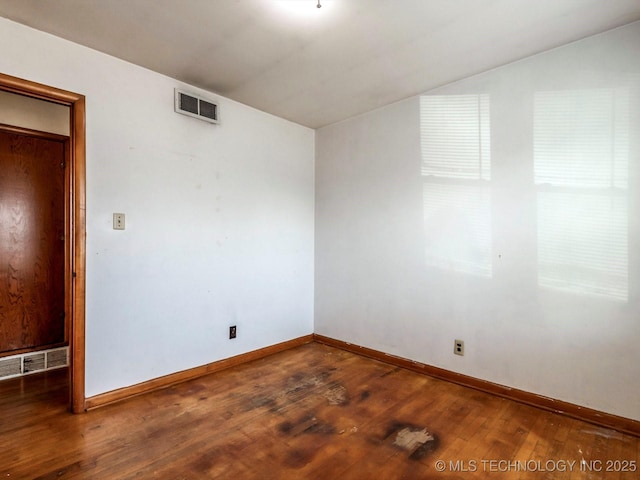 unfurnished room featuring wood-type flooring