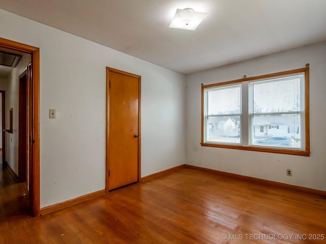 unfurnished room featuring light wood-type flooring