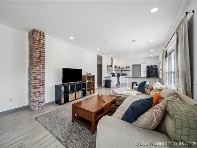 living room with light hardwood / wood-style floors