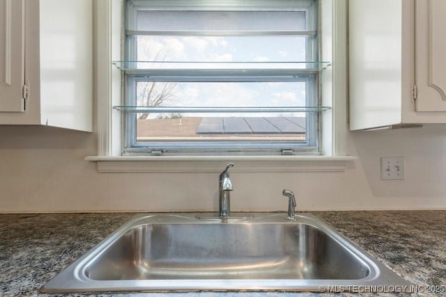 room details with sink and white cabinetry