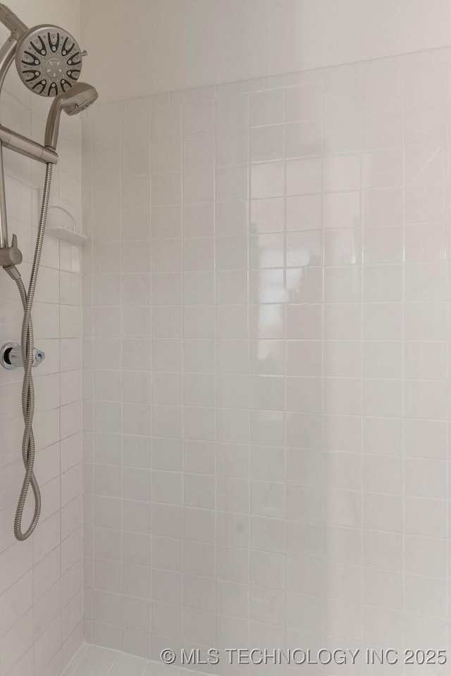 bathroom with a tile shower