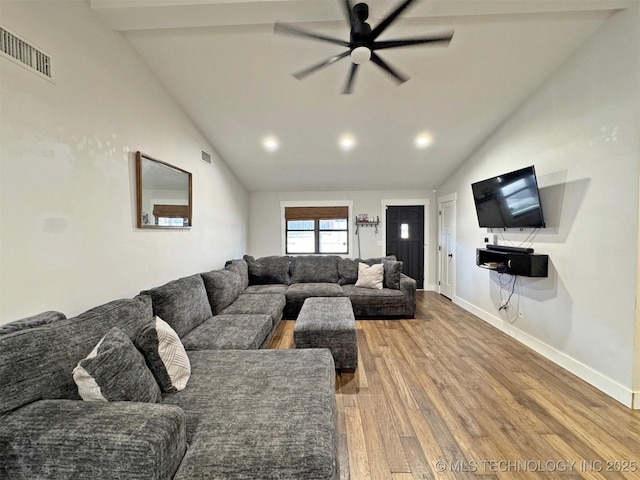 living room featuring vaulted ceiling, ceiling fan, and hardwood / wood-style floors