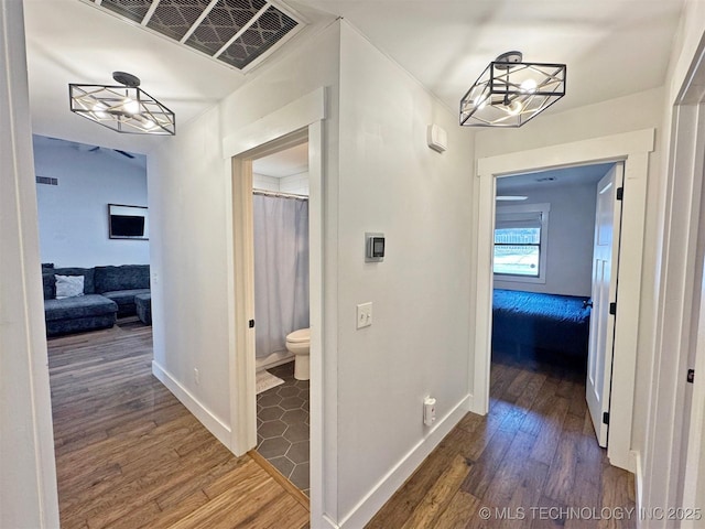 hall with dark wood-type flooring