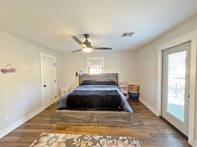 bedroom featuring ceiling fan, access to exterior, and hardwood / wood-style floors