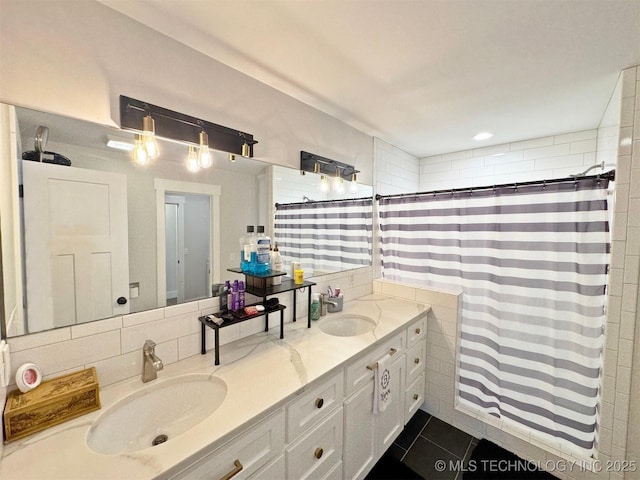 bathroom featuring decorative backsplash, tile patterned floors, a shower with shower curtain, and vanity