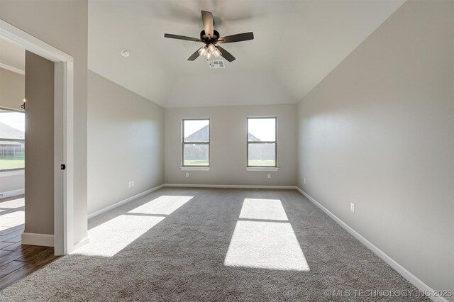 unfurnished room featuring ceiling fan, carpet, and lofted ceiling