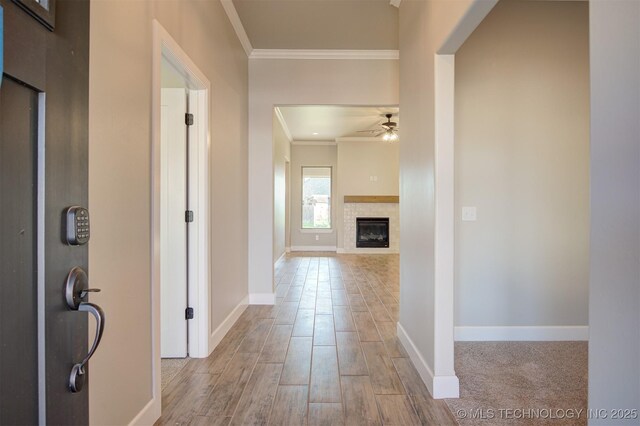 corridor featuring crown molding