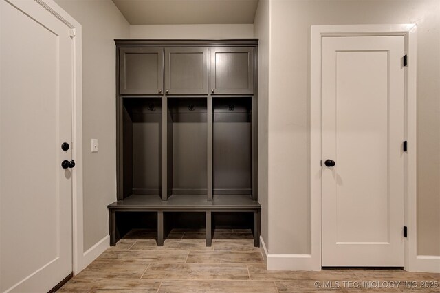 mudroom with light hardwood / wood-style floors