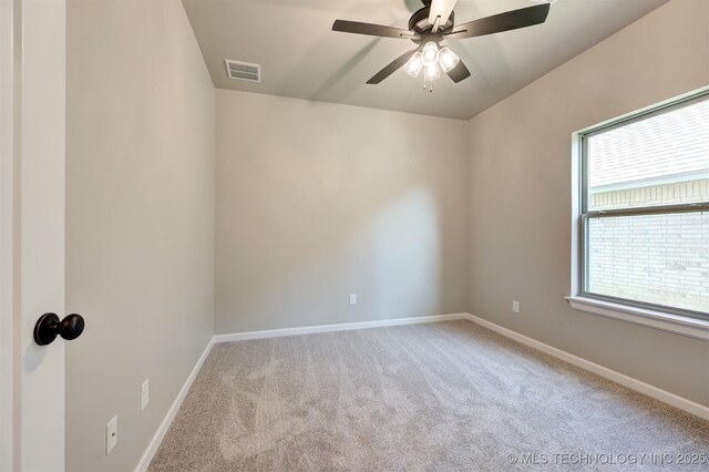 carpeted empty room with ceiling fan