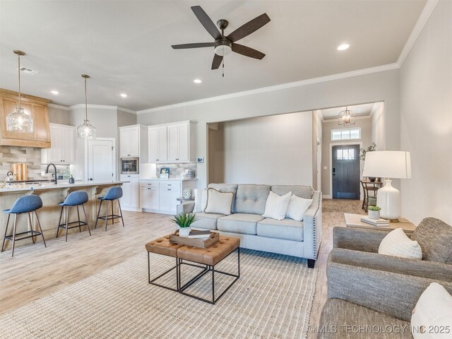 7113 E Princeton St, Broken Arrow, OK 74014 - living area with recessed lighting, ceiling fan, light wood-style floors, and crown molding