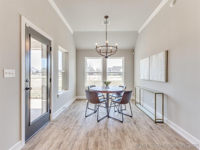 7113 E Princeton St, Broken Arrow, OK 74014 - dining room with a chandelier, ornamental molding, and light wood-style floors