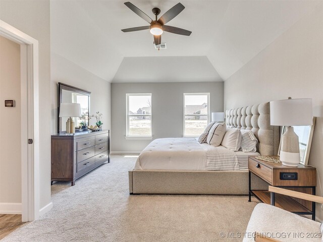 7113 E Princeton St, Broken Arrow, OK 74014 - bedroom with multiple windows, light colored carpet, lofted ceiling, and ceiling fan
