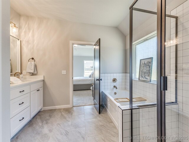 7113 E Princeton St, Broken Arrow, OK 74014 - ensuite bathroom with vanity, a garden tub, and lofted ceiling