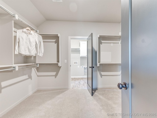 7113 E Princeton St, Broken Arrow, OK 74014 - spacious closet with carpet floors and vaulted ceiling