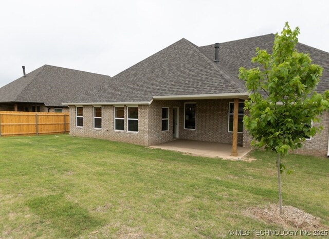 7113 E Princeton St, Broken Arrow, OK 74014 - back of house with roof with shingles, brick siding, and a patio