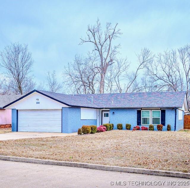 ranch-style home with a garage