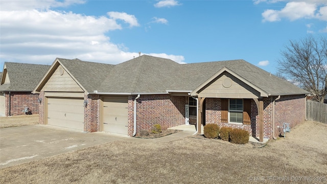 single story home featuring a garage and a front lawn