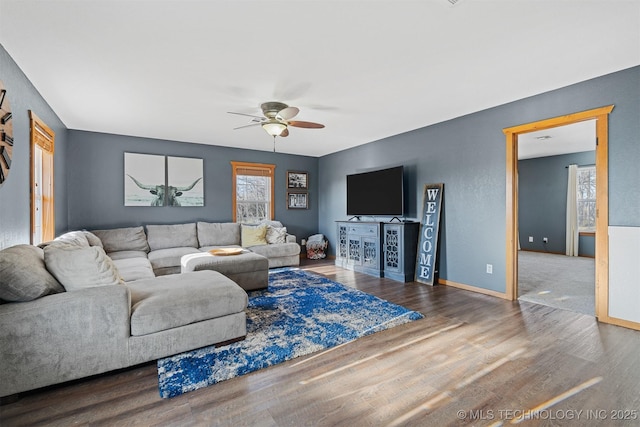 living room with hardwood / wood-style flooring and ceiling fan