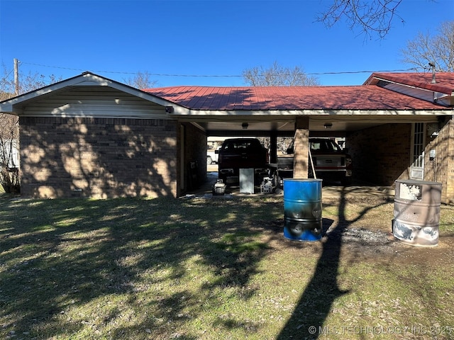 view of home's exterior with a lawn and a carport