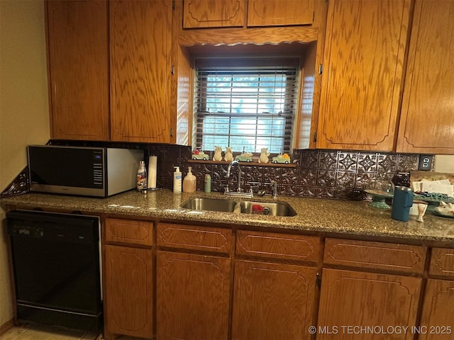 kitchen featuring sink, backsplash, and dishwasher