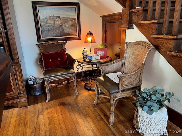 living area with lofted ceiling and wood-type flooring