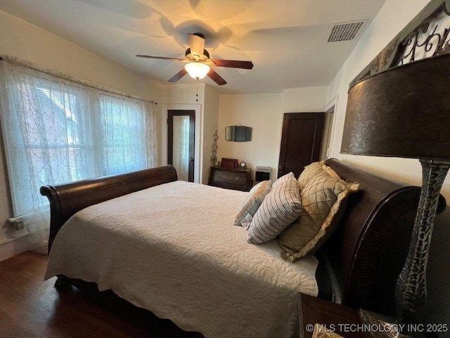 bedroom featuring dark wood-type flooring and ceiling fan