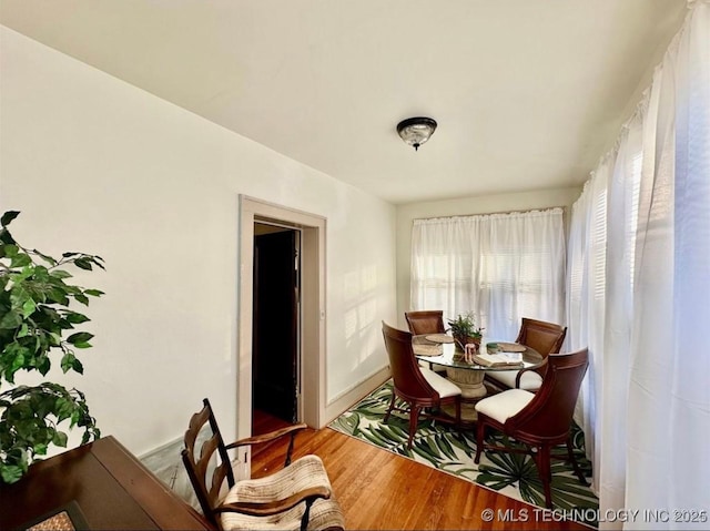 dining room with hardwood / wood-style floors