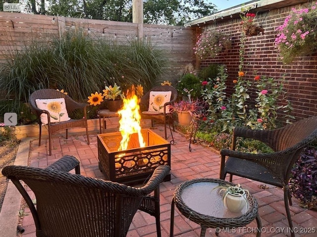 view of patio / terrace with a fire pit